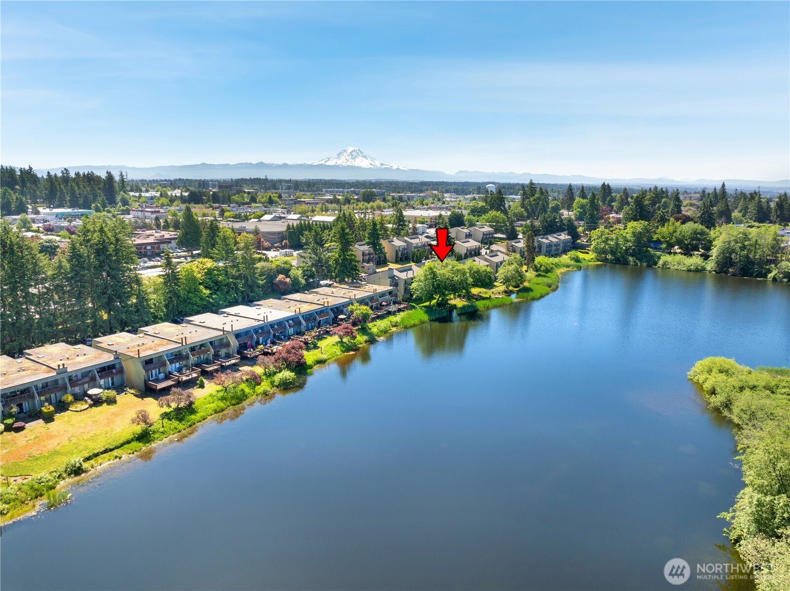 31003 14th Avenue South, Unit C4 Federal Way, WA 98003 - Photo 21 of 22 an aerial view of a house with swimming pool patio and lake view