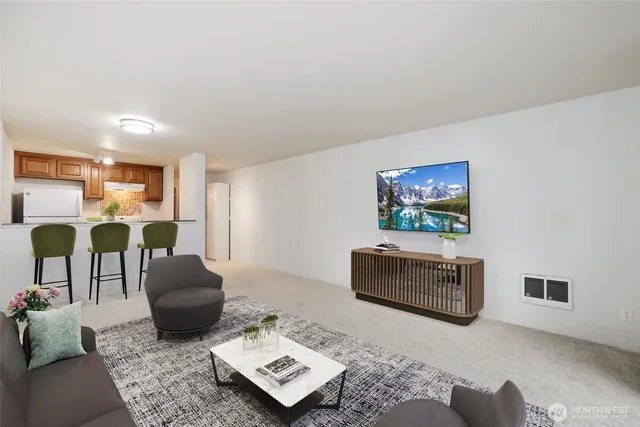 a living room with furniture and a rug