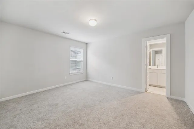 a view of an empty room and a window