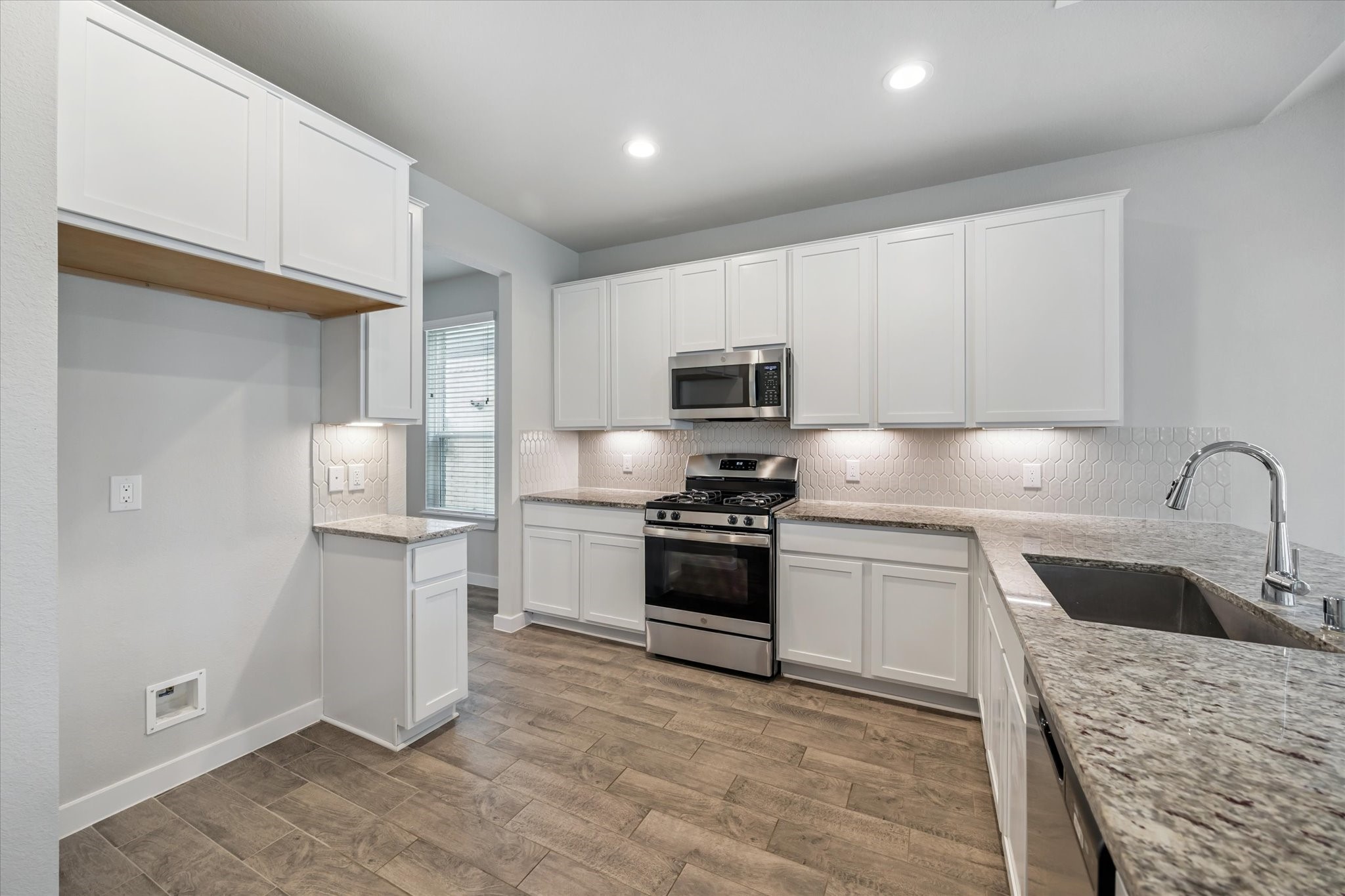 2138 Reed Cave Lane Spring, TX 77386 - Photo 6 of 23 a kitchen with stainless steel appliances granite countertop a refrigerator sink and stove