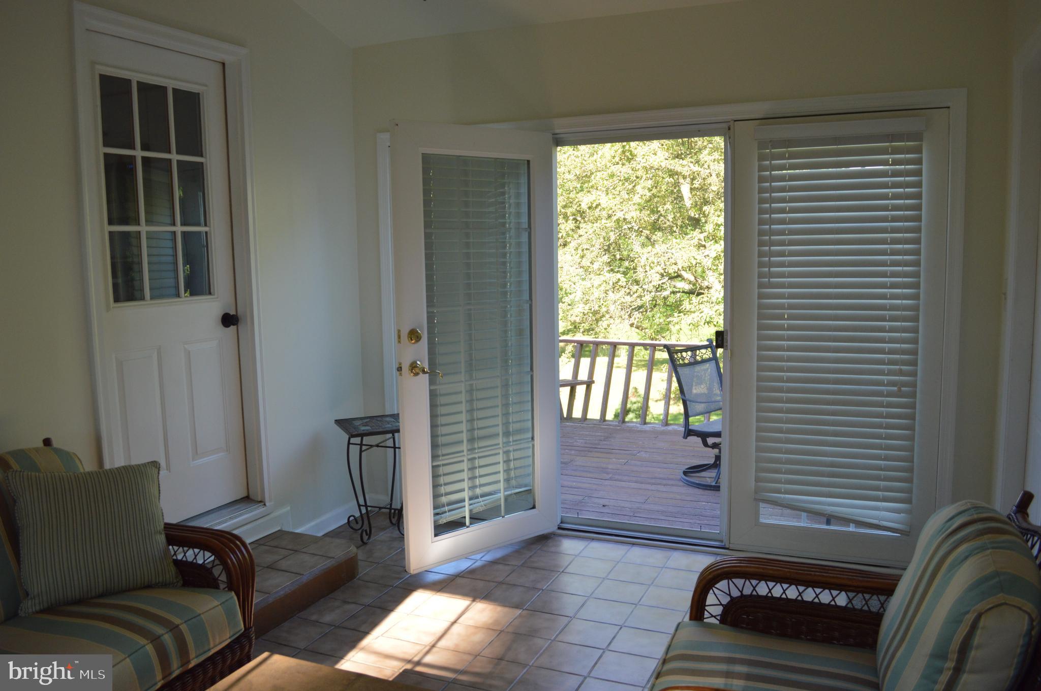 239 Walker Road Lincoln University, PA 19352 - Photo 14 of 25 Sunroom leads to deck