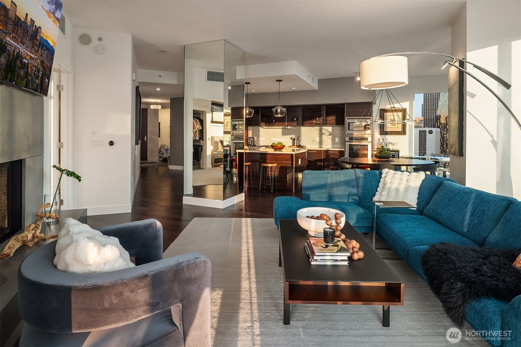 1920 4th Avenue, Unit 2202 Seattle, WA 98101 - Photo 18 of 35 a living room with furniture and a large window