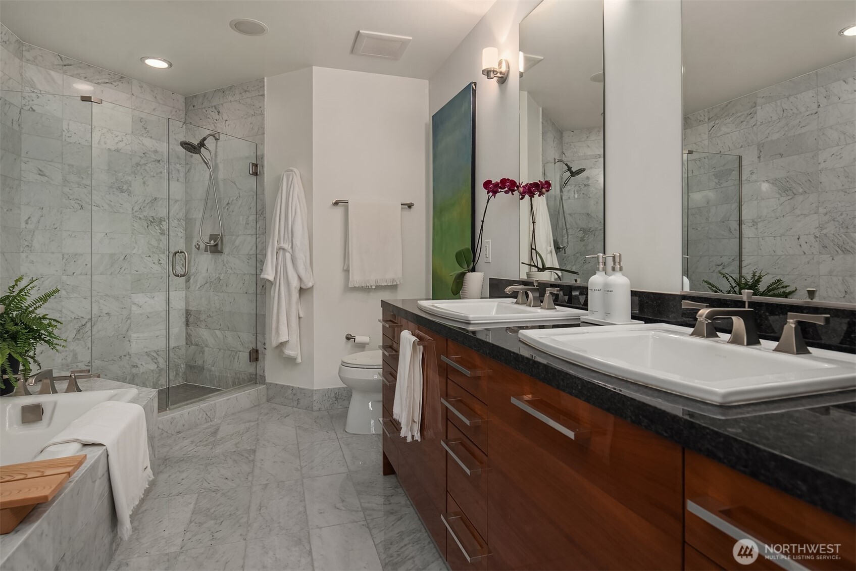1920 4th Avenue, Unit 2202 Seattle, WA 98101 - Photo 22 of 35 a spacious bathroom with a granite countertop sink mirror and a shower