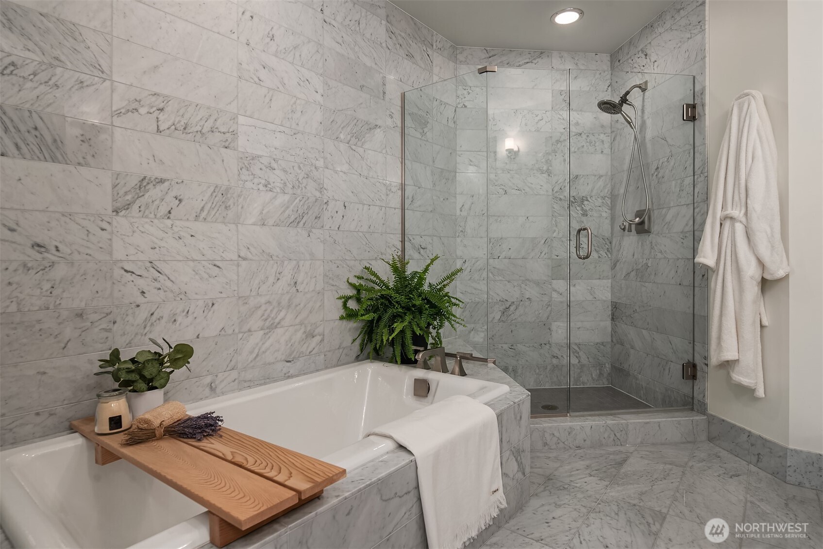 1920 4th Avenue, Unit 2202 Seattle, WA 98101 - Photo 23 of 35 a bathroom with a tub shower and a sink