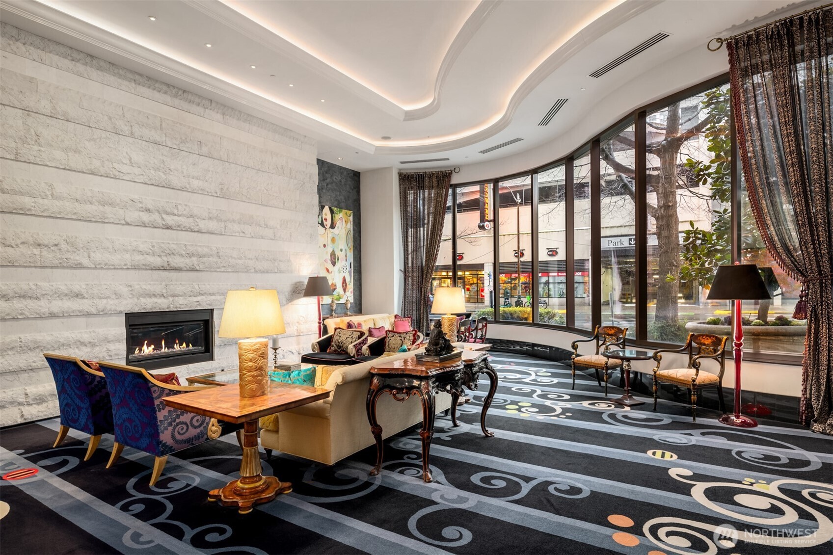 1920 4th Avenue, Unit 2202 Seattle, WA 98101 - Photo 29 of 35 a living room with furniture and floor to ceiling windows