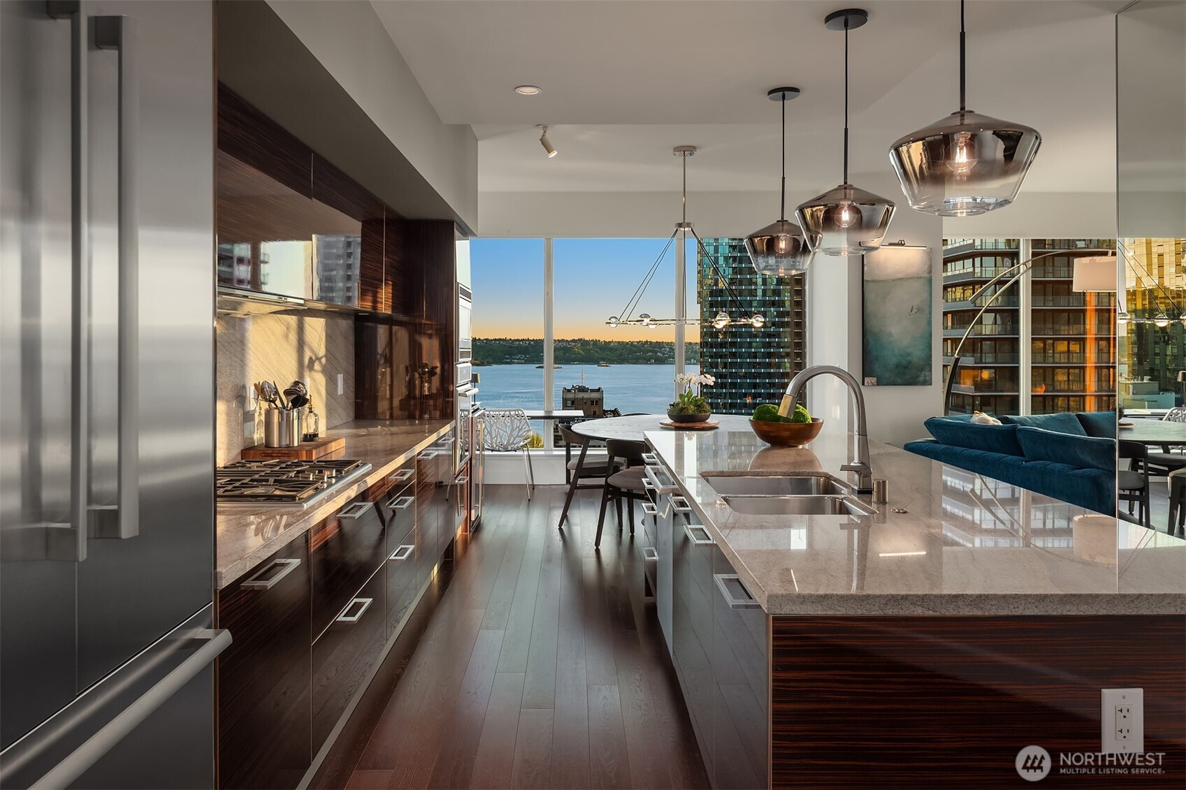 1920 4th Avenue, Unit 2202 Seattle, WA 98101 - Photo 4 of 35 a kitchen with stainless steel appliances granite countertop a sink a stove and a refrigerator
