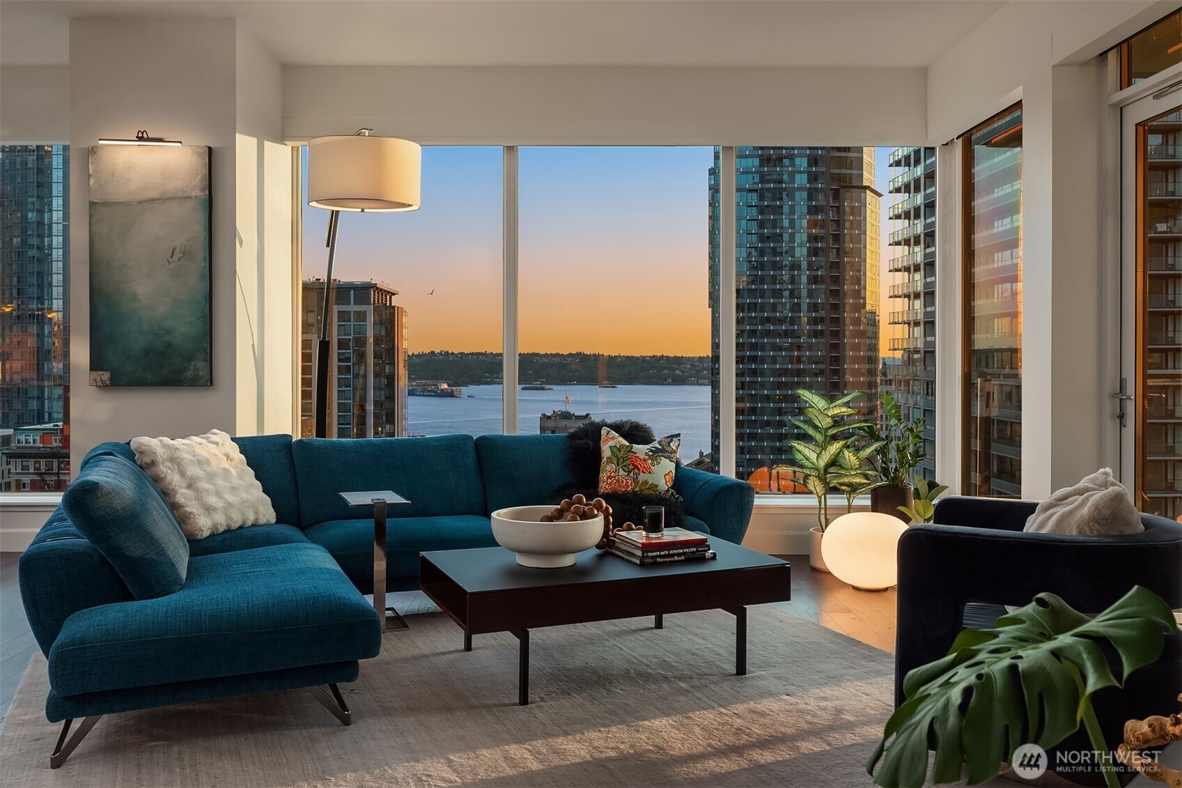 1920 4th Avenue, Unit 2202 Seattle, WA 98101 - Photo 5 of 35 a living room with furniture and a potted plant