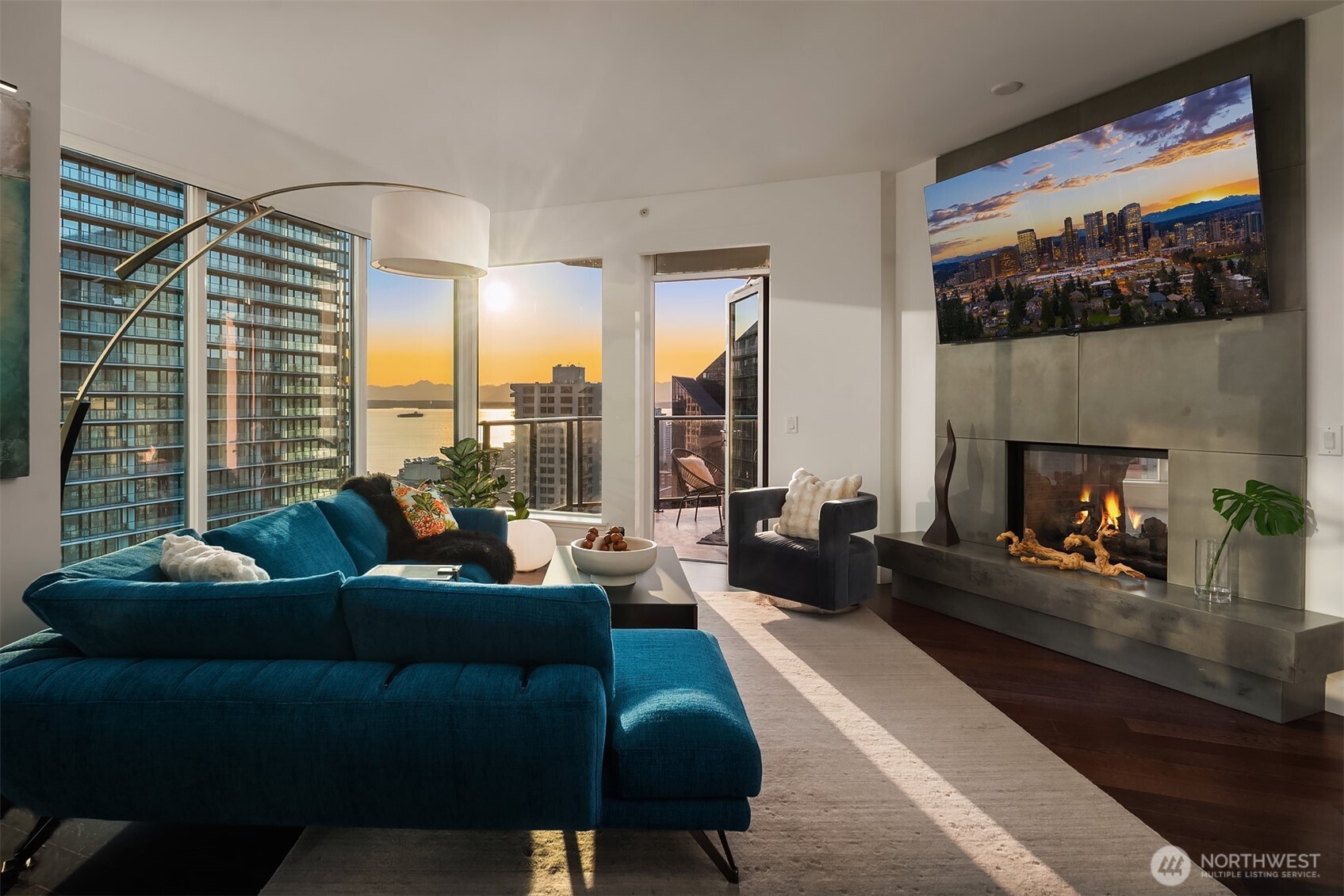 1920 4th Avenue, Unit 2202 Seattle, WA 98101 - Photo 6 of 35 a living room with furniture and a fireplace