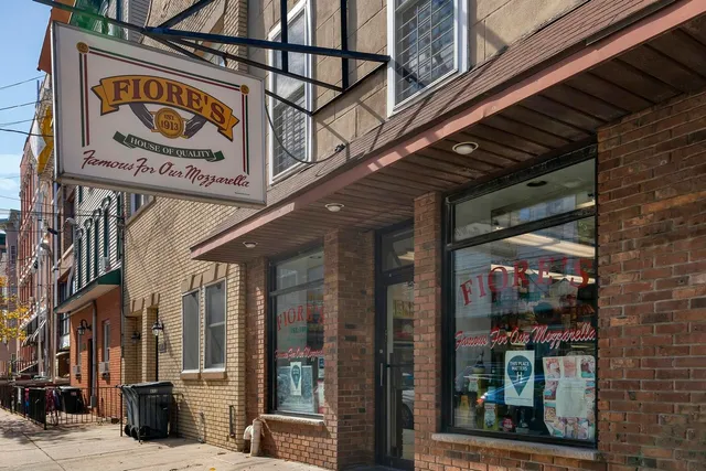 a group of cars parked in front of a building