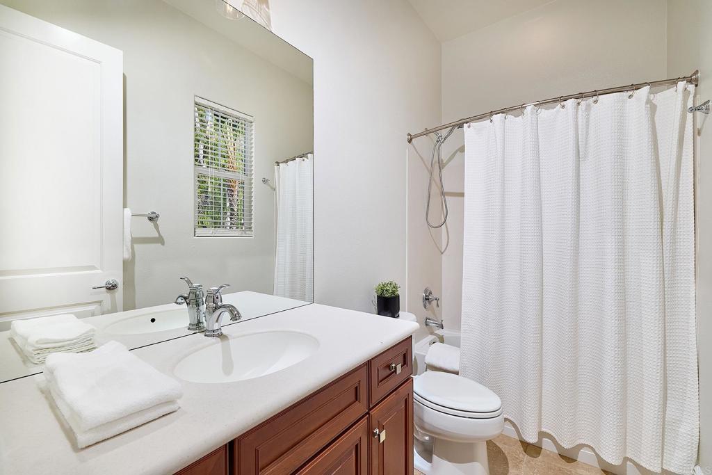 3230 Corte Aliso Carlsbad, CA 92009 - Photo 11 of 23 a bathroom with a sink toilet and shower