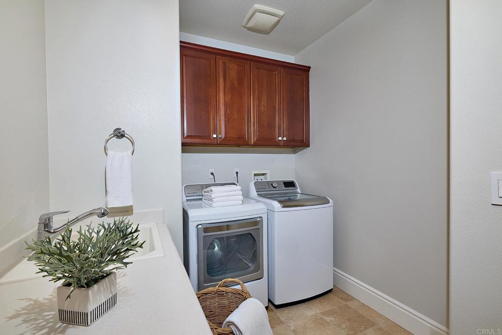 3230 Corte Aliso Carlsbad, CA 92009 - Photo 12 of 23 a utility room with dryer and washer