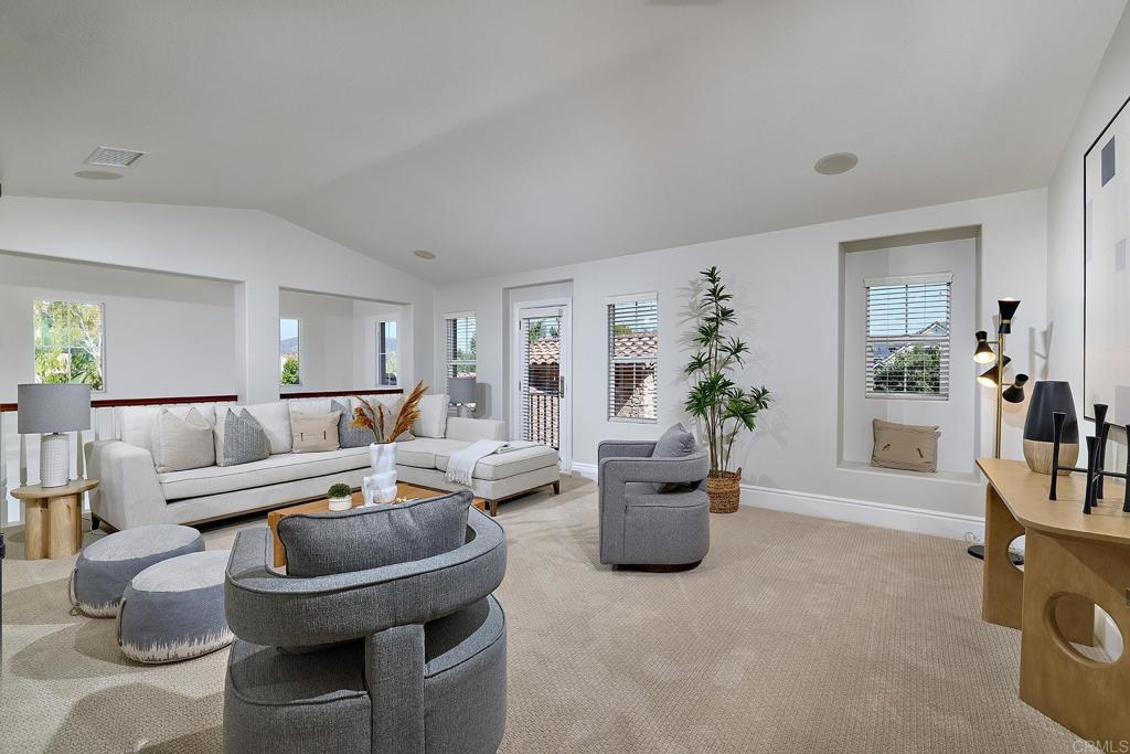 3230 Corte Aliso Carlsbad, CA 92009 - Photo 17 of 23 a living room with furniture a dining table and a potted plant