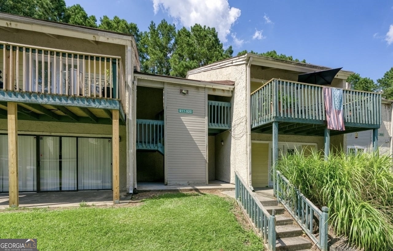 3575 Oakvale Road, Unit 911 Decatur, GA 30034 - Photo 1 of 10 a view of a house with a yard and plants