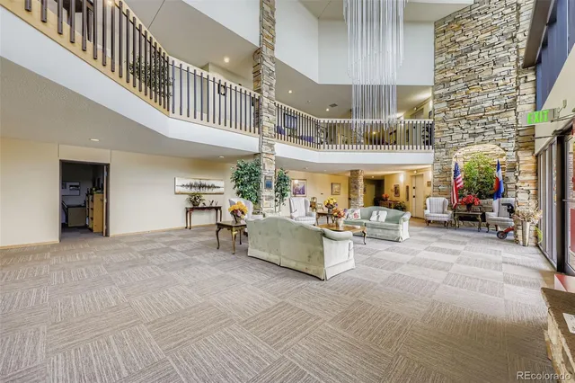 a view of living room filled with furniture and furniture
