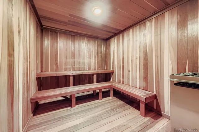 a living room with a bed and a window