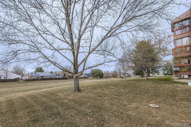 a large building with a mountain in the background