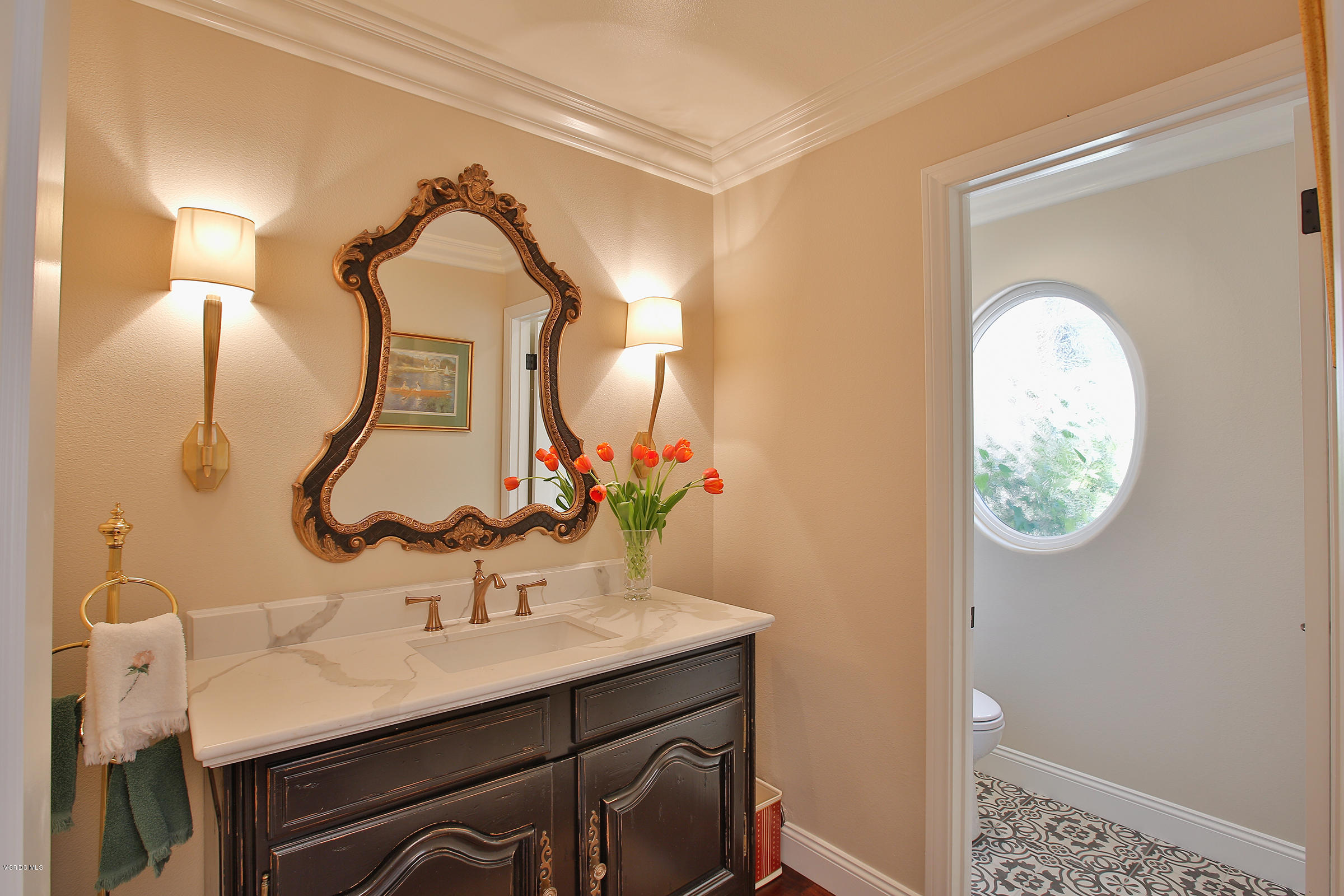 38 Inverness Road Thousand Oaks, CA 91361 - Photo 12 of 35 a bathroom with a sink and a mirror
