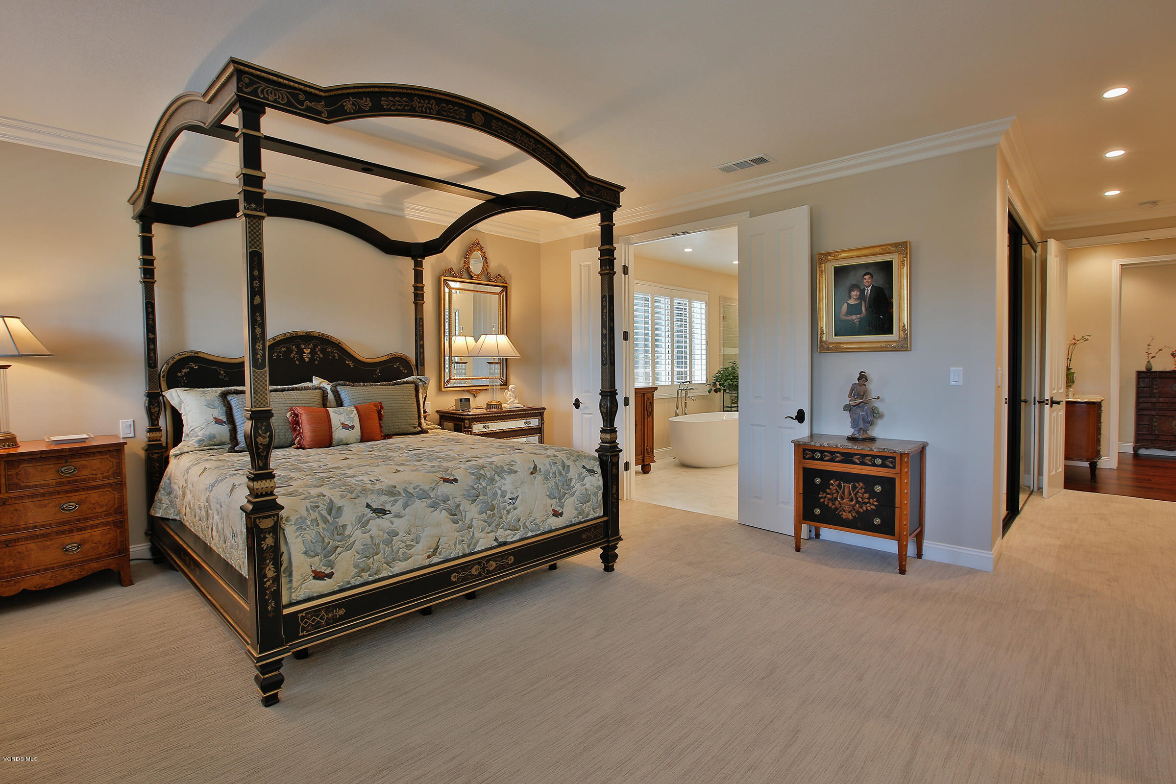 38 Inverness Road Thousand Oaks, CA 91361 - Photo 16 of 35 a bedroom with a bed and a chandelier