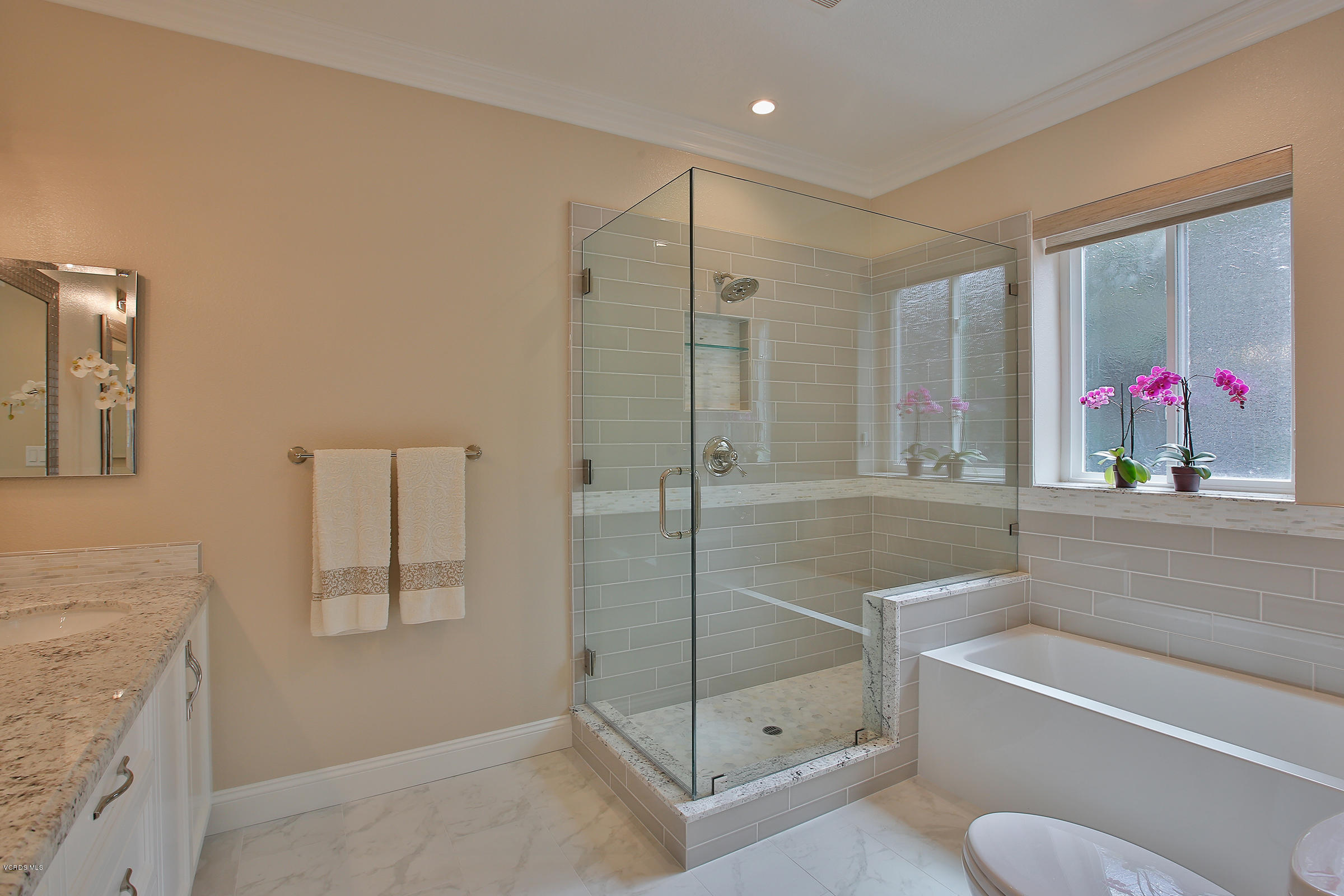 38 Inverness Road Thousand Oaks, CA 91361 - Photo 24 of 35 a bathroom with a tub shower sink mirror and toilet