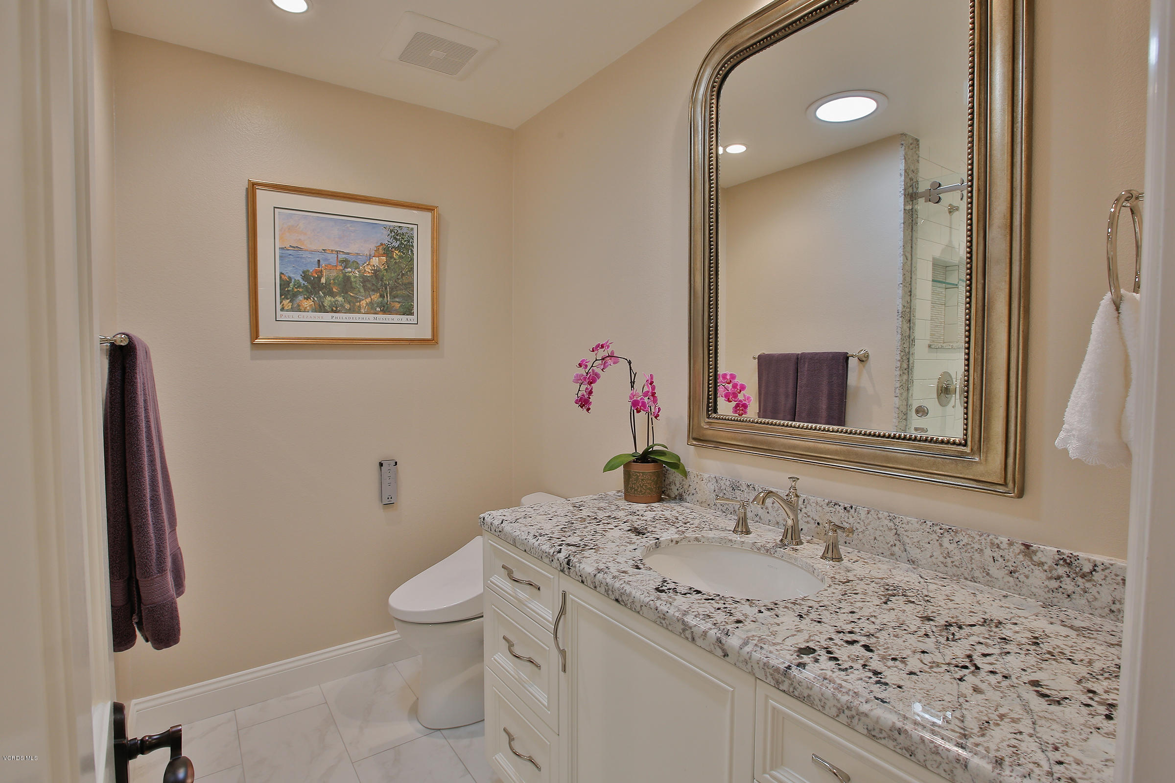 38 Inverness Road Thousand Oaks, CA 91361 - Photo 27 of 35 a bathroom with a granite countertop sink a toilet and mirror