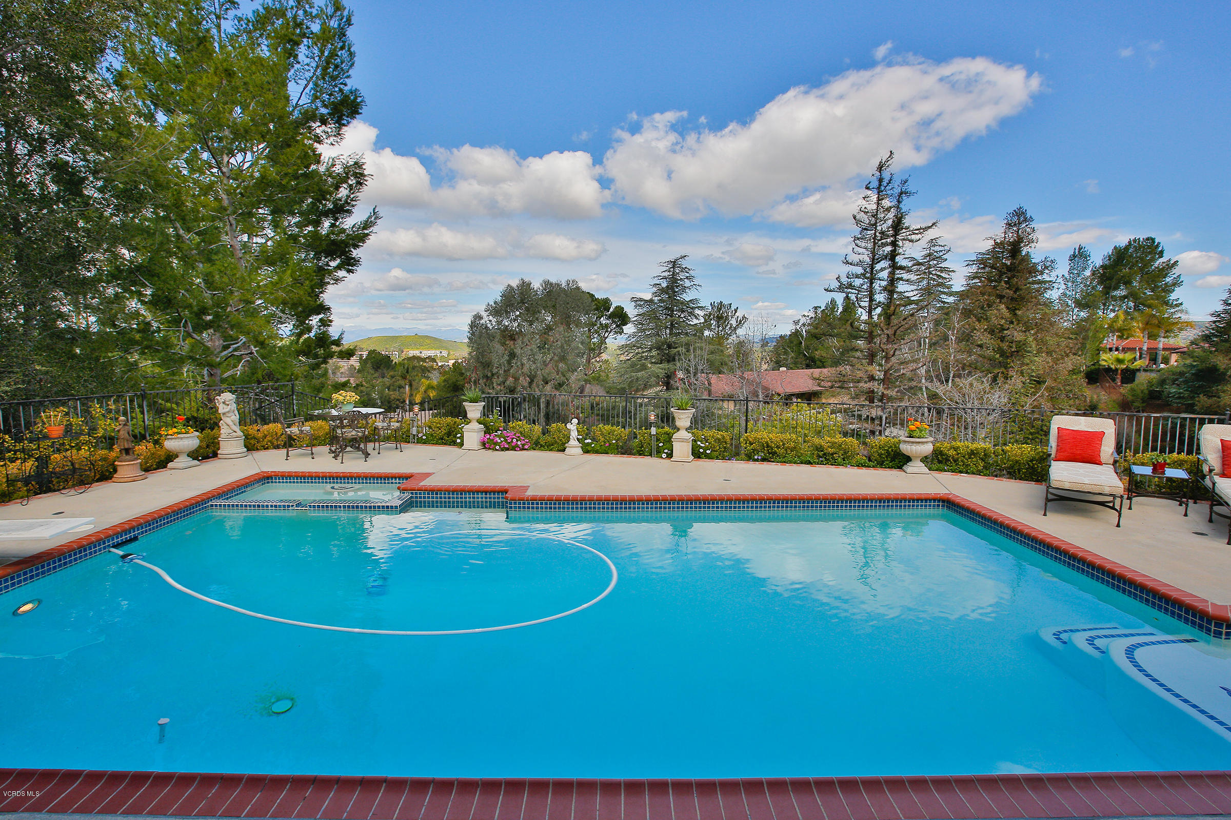 38 Inverness Road Thousand Oaks, CA 91361 - Photo 5 of 35 a view of a swimming pool with an outdoor seating and a yard