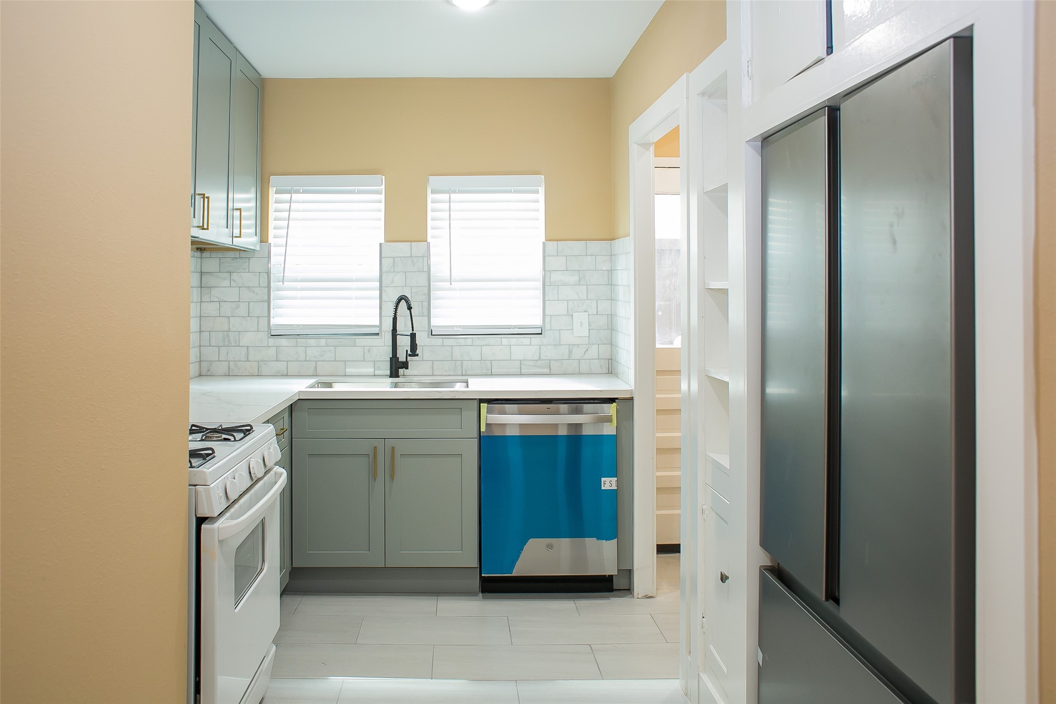 2301 Albans Road Houston, TX 77005 - Photo 12 of 17 a kitchen with a sink stove and refrigerator