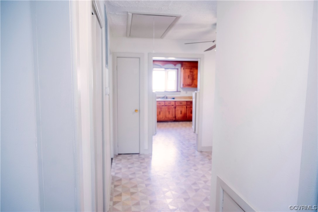 12411 Lewis Road Chester, VA 23831 - Photo 27 of 34 a view of a hallway with a window and a bathroom