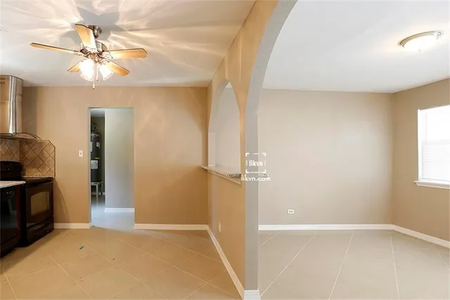a view of an empty room with a fireplace