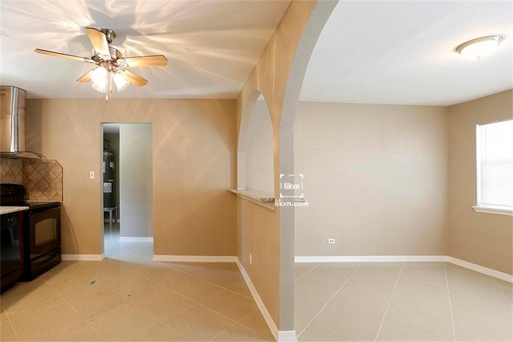 1112 Georgina Street Rosenberg, TX 77471 - Photo 7 of 14 a view of an empty room with a fireplace