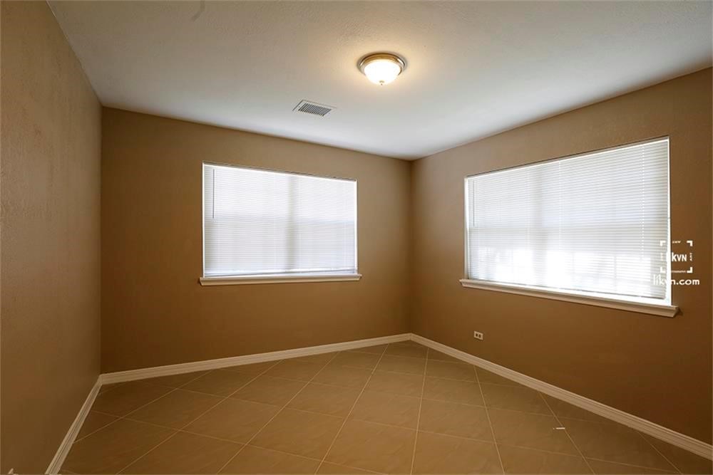 1112 Georgina Street Rosenberg, TX 77471 - Photo 9 of 14 an empty room with windows