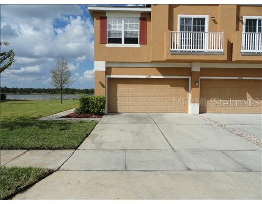 10872 Derringer Drive Orlando, FL 32829 - Photo 1 of 1 a front view of a house having yard