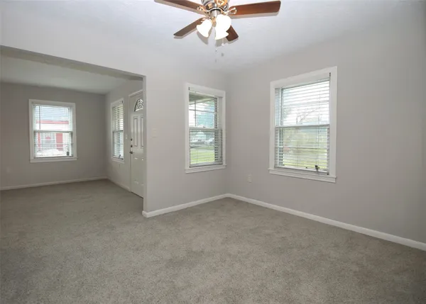 a view of an empty room with a window
