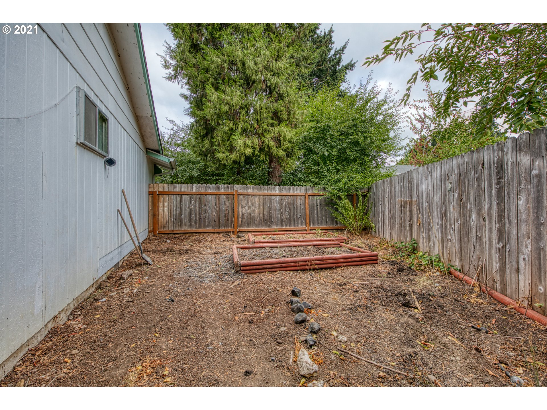6509 E Street Springfield, OR 97478 - Photo 22 of 28 a view of a backyard with wooden fence