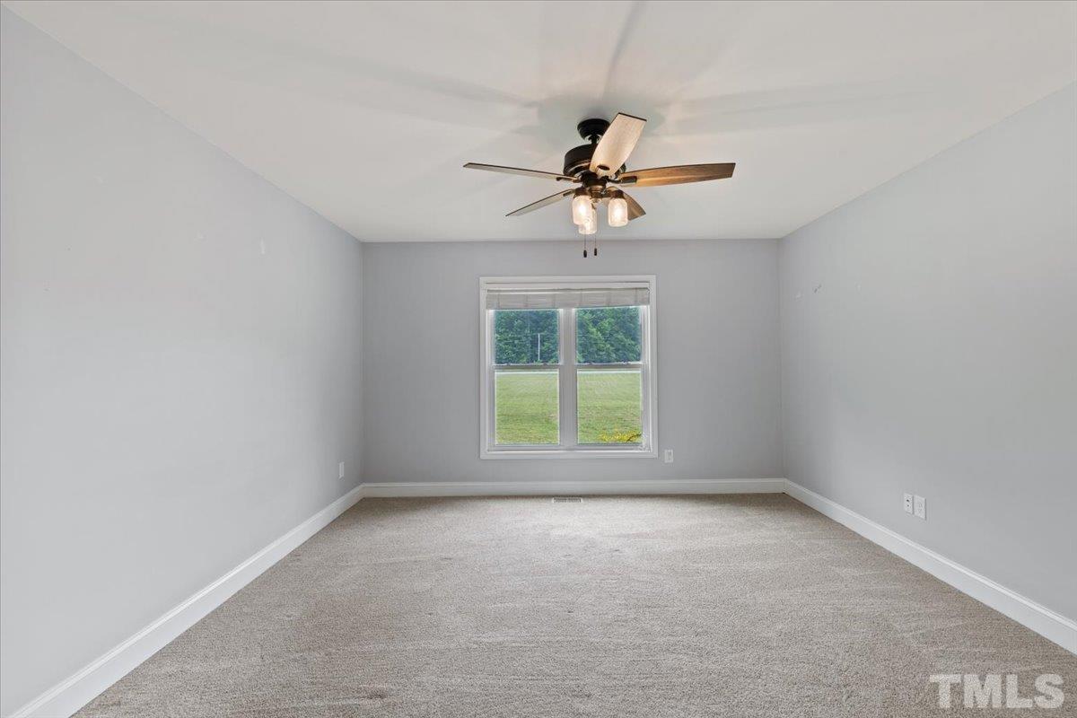 11208 Range Road Rougemont, NC 27572 - Photo 15 of 40 an empty room with a window