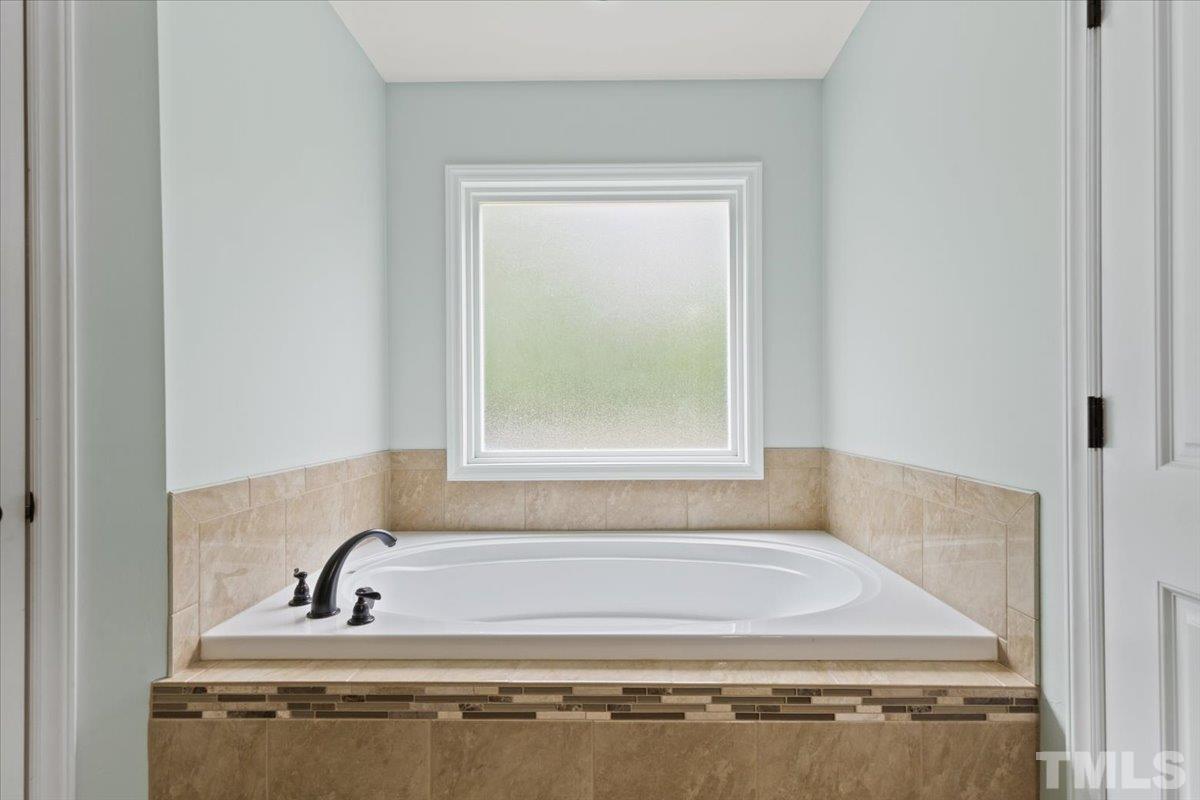 11208 Range Road Rougemont, NC 27572 - Photo 17 of 40 a bathroom with a bath tub