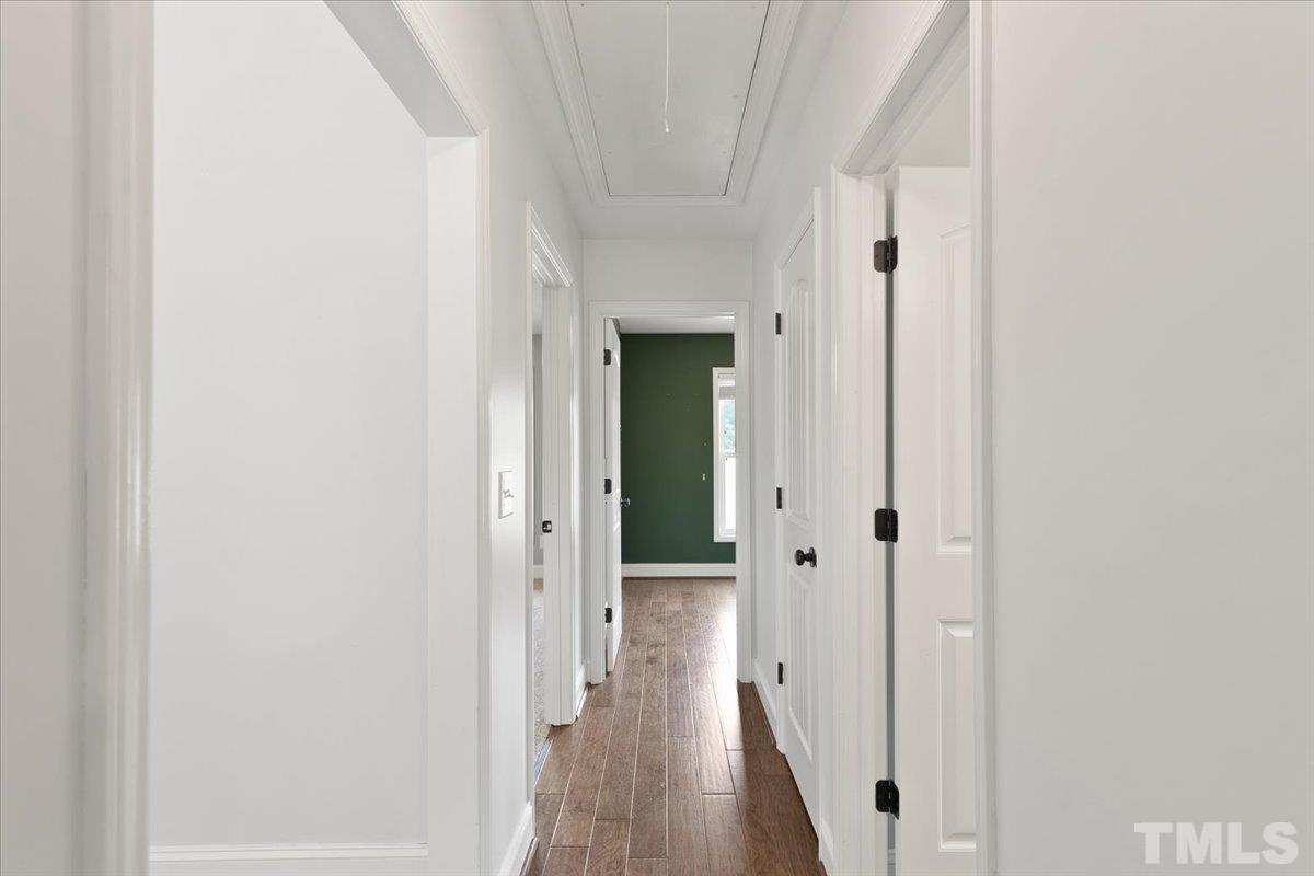 11208 Range Road Rougemont, NC 27572 - Photo 20 of 40 a view of a hallway with wooden floor