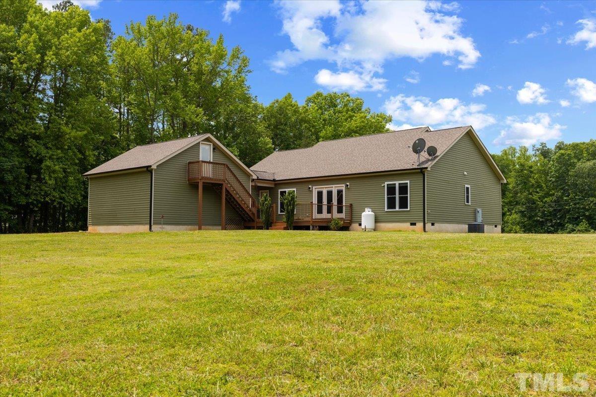 11208 Range Road Rougemont, NC 27572 - Photo 36 of 40 a front view of a house with a garden