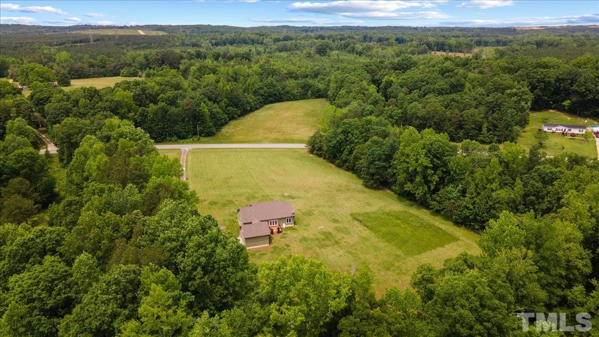 11208 Range Road Rougemont, NC 27572 - Photo 37 of 40 a view of a yard with a swimming pool and mountain view