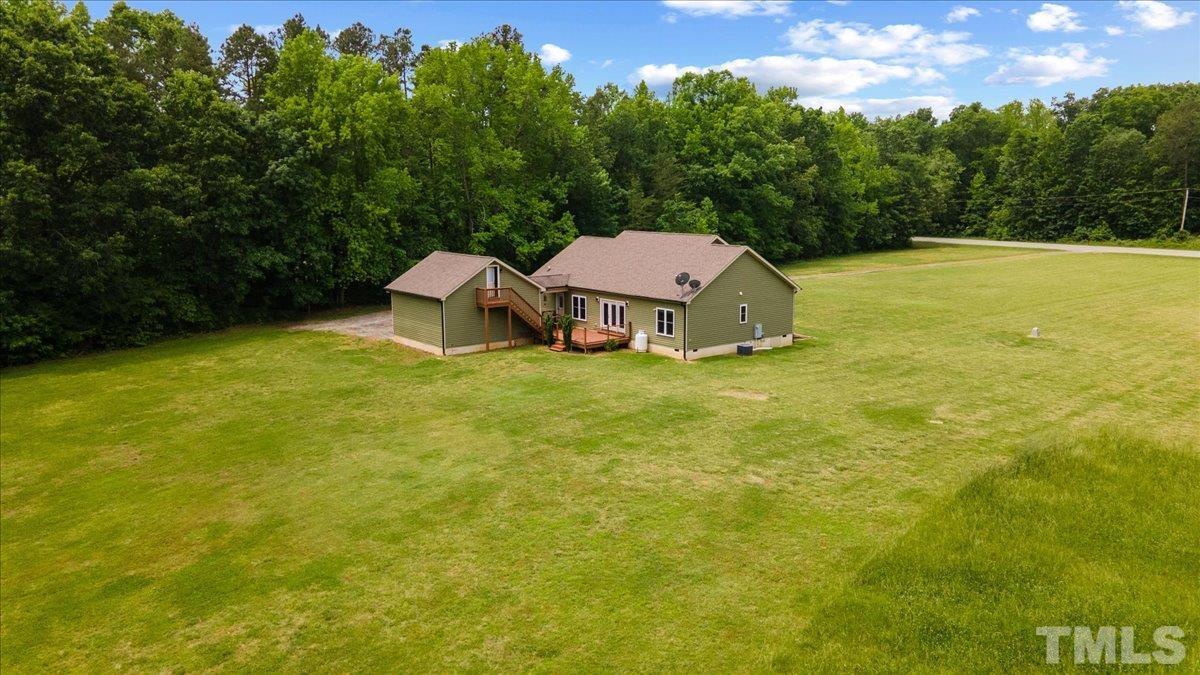 11208 Range Road Rougemont, NC 27572 - Photo 39 of 40 a view of a large garden with an outdoor space and seating area