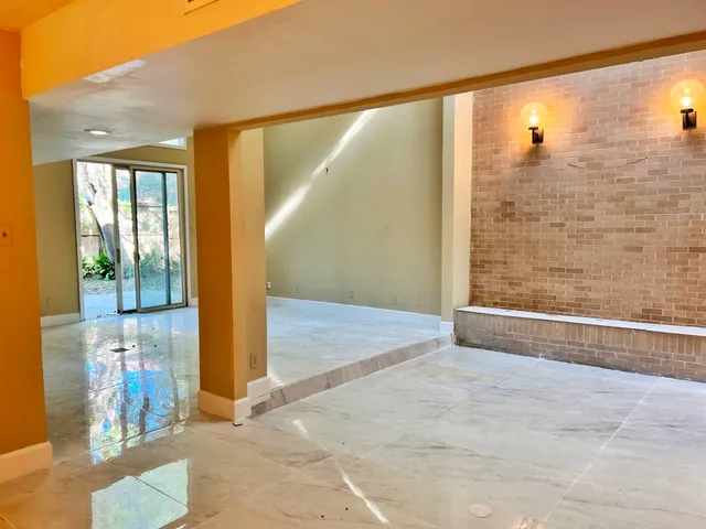 a view of a yard with wooden fence