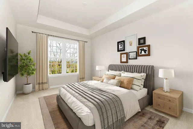 a bedroom with a large bed and a couch