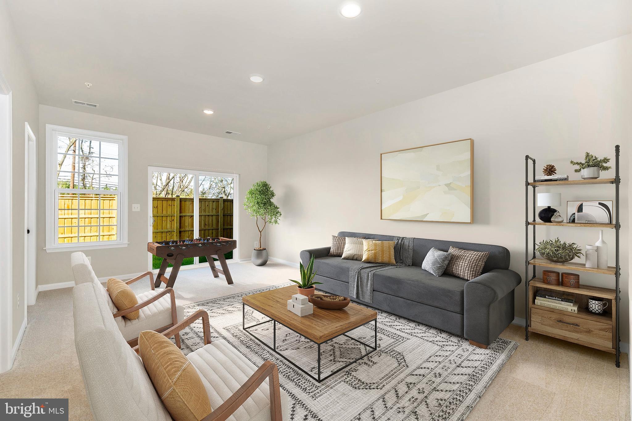 101 Spring Bank Way Frederick, MD 21701 - Photo 3 of 20 a living room with furniture and a flat screen tv