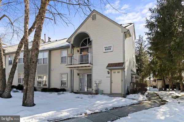a view of a house with a small yard