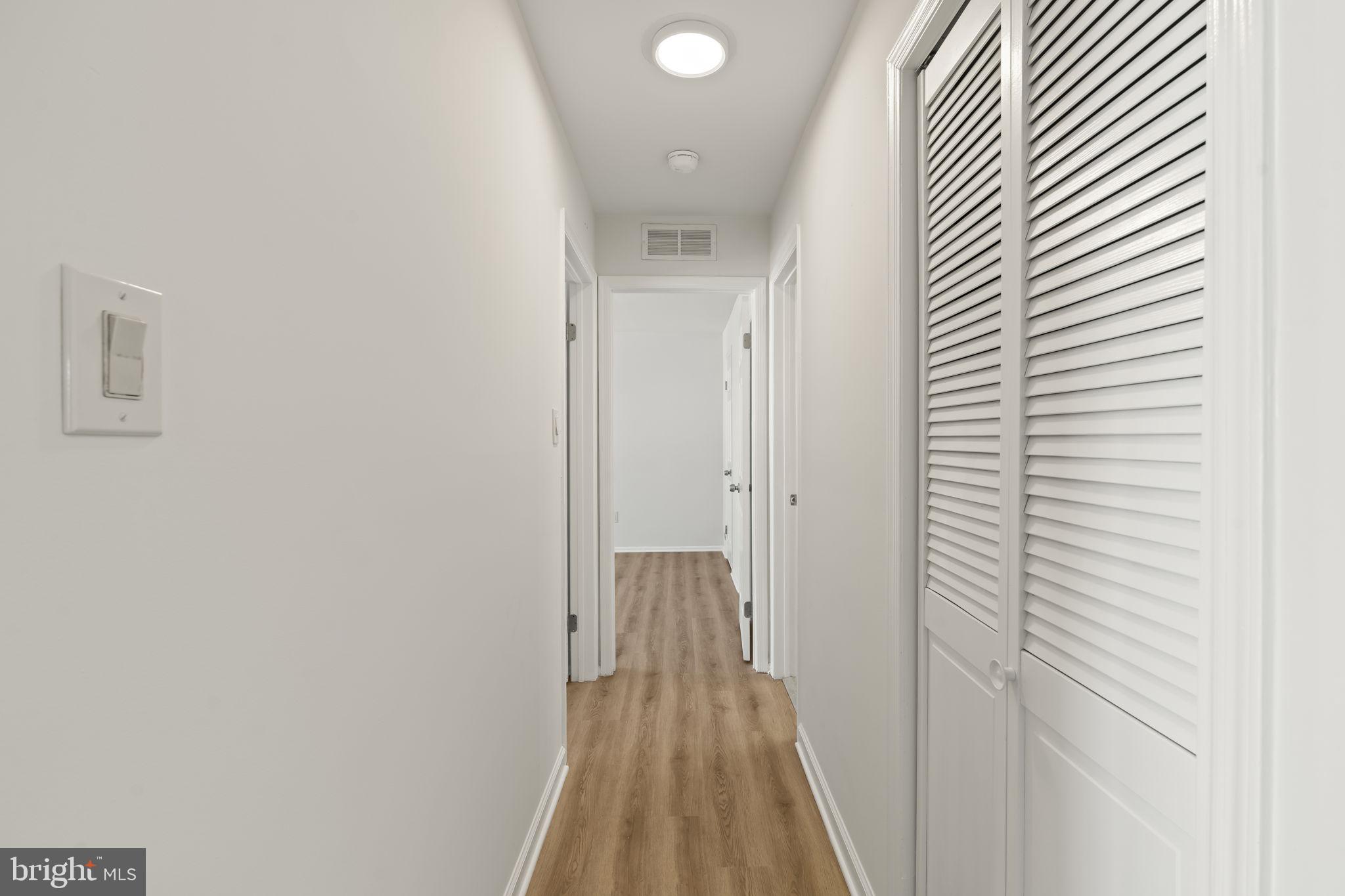 5508 B Albridge Way Mount Laurel, NJ 08054 - Photo 18 of 27 a view of a hallway with wooden floor and closet