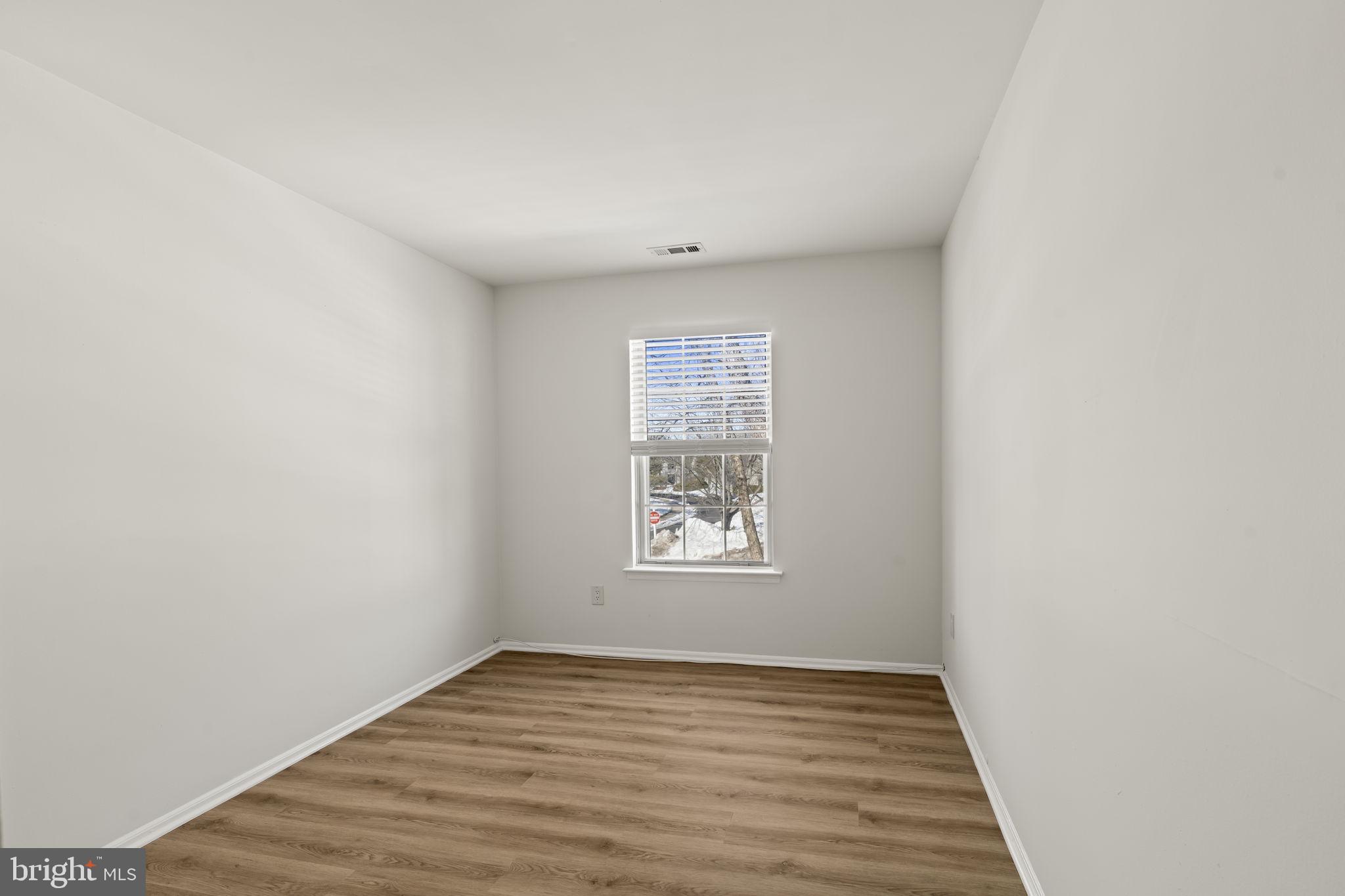5508 B Albridge Way Mount Laurel, NJ 08054 - Photo 19 of 27 a view of an empty room with wooden floor and a window