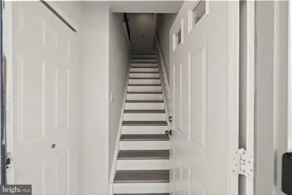 a view of a hallway with stairs