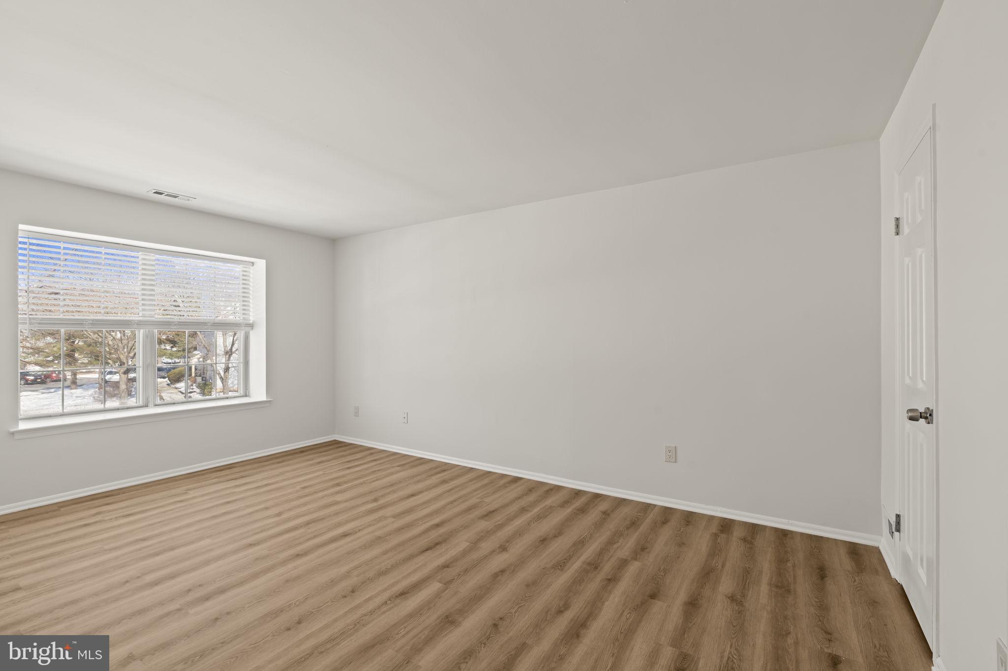 5508 B Albridge Way Mount Laurel, NJ 08054 - Photo 21 of 27 an empty room with wooden floor and windows