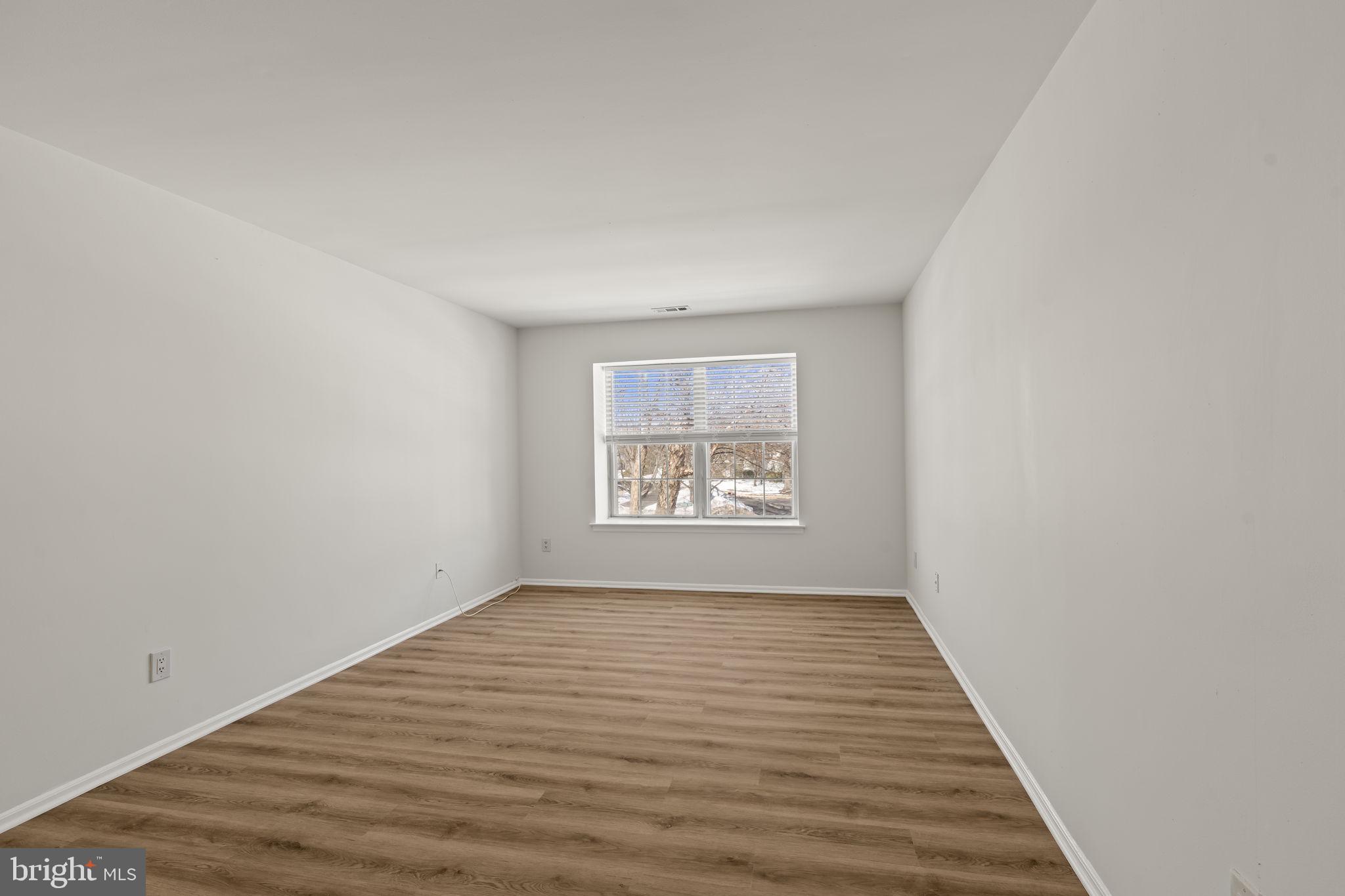 5508 B Albridge Way Mount Laurel, NJ 08054 - Photo 23 of 27 a view of an empty room with wooden floor and a window