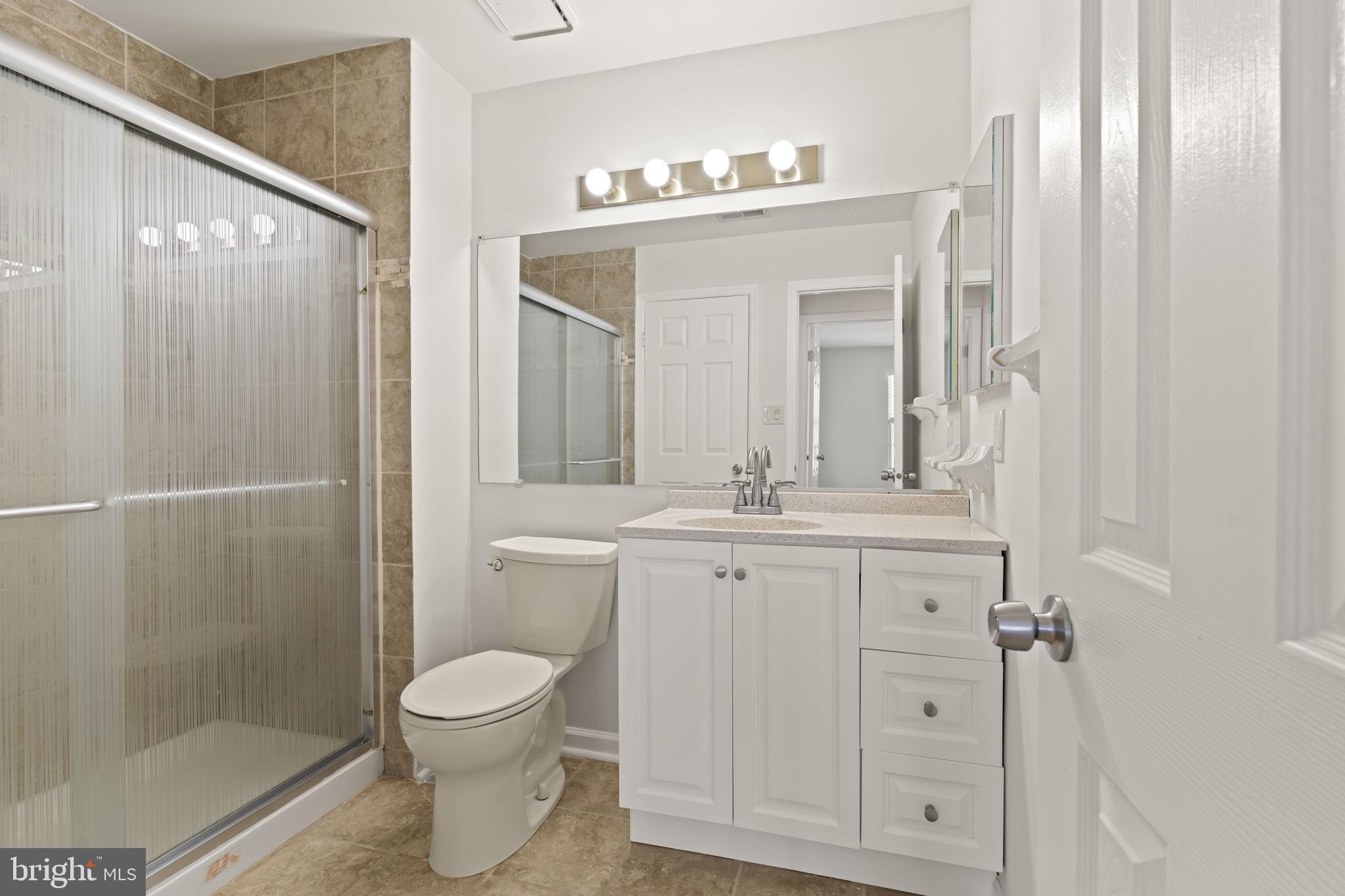 5508 B Albridge Way Mount Laurel, NJ 08054 - Photo 25 of 27 a bathroom with a toilet a sink and a mirror