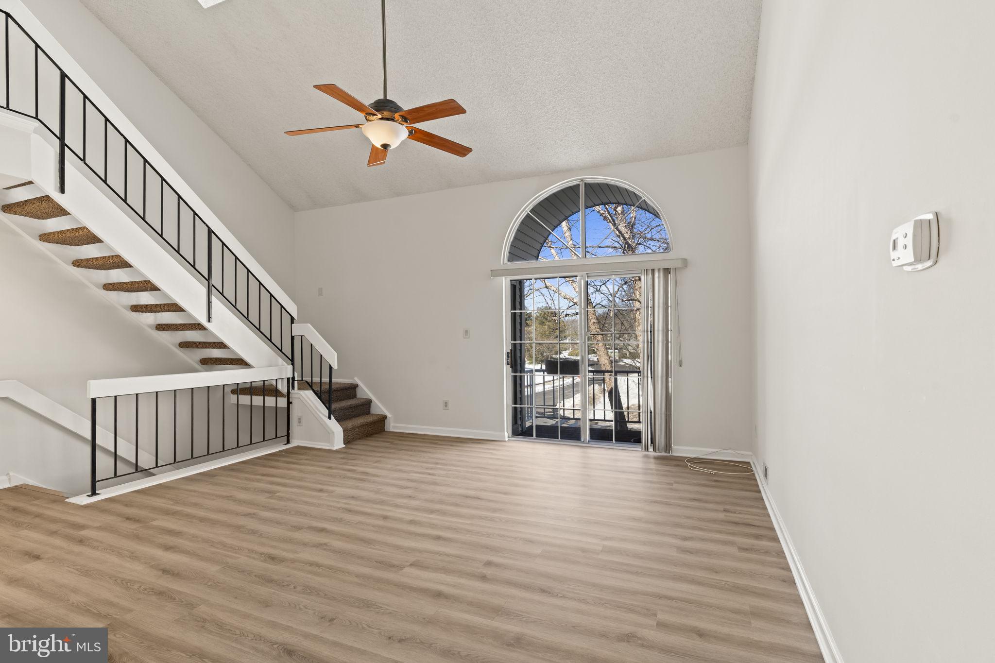 5508 B Albridge Way Mount Laurel, NJ 08054 - Photo 4 of 27 a view of a livingroom with wooden floor stairs and a chandelier
